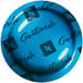 A blue Nespresso box of Guatemala coffee capsules on a table with a blue plate with black text saying "Guatemala" on it.