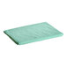 An Oxford green quilted mattress pad on a white background.
