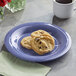 A purple Acopa Foundations wide rim melamine plate with cookies and a cup of coffee on it.