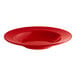 An Acopa Foundations red melamine bowl with a white rim.