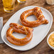 A plate with Eastern Standard Provisions Topknot soft pretzels.
