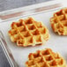 A group of Eastern Standard Provisions Plain Belgian Liege Waffles on a baking sheet.