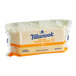 A package of Tillamook medium white cheddar cheese slices.