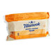 A package of Tillamook Deli Sliced Medium Yellow Cheddar Cheese in a plastic bag.