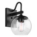 A Canarm Oli matte black outdoor wall light with a clear glass globe.