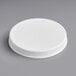 A 110/400 white plastic lid with a ribbed cap on a white surface.