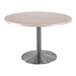 A Holland Bar Stool round table with a white ash EnduroTop and stainless steel base.
