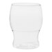 A clear Tossware plastic pint glass with a curved bottom on a white background.