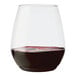 A Tossware plastic Vino XL glass filled with red wine.