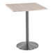 A Holland Bar Stool white ash square table with a stainless steel base.
