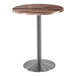A Holland Bar Stool EnduroTop 30" round table with a metal base and wood surface.