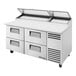 A True commercial refrigerated pizza prep table with drawers.