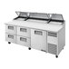 A True refrigerated pizza prep table with four drawers and one door.