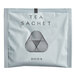 A white box of Dona black tea sachets with a black and white triangle logo.