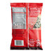 A red Nescafe Clasico Instant Coffee pouch with white and black text.