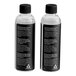 Two Breville commercial bubble liquid refill bottles with black labels.