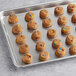 A tray of Otis Spunkmeyer Whole Grain Carnival cookie dough balls.