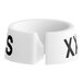 A white plastic ring with the letters "XXS" on it.