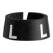 A black plastic ring with white letters that says "L"