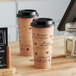 Choice 24 oz. Cafe Print Poly Paper Hot Cup and Lid - 100/Pack