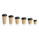 A row of Choice double wall ripple paper hot cups with black lids.
