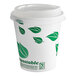 A white EcoChoice paper hot cup with green leaves on it.