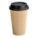A brown paper coffee cup with a black lid.