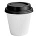 A white paper hot cup with a black double wall and lid with black text.