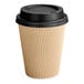 A brown paper cup with a black lid.