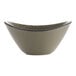 An International Tableware stoneware fruit bowl with a speckled green rim.