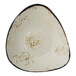 A white triangular stoneware bowl with a brown speckled design.