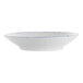 A white porcelain serving bowl with blue sponged lines on the rim.
