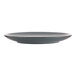 An International Tableware stoneware coupe plate with a dark gray center and black rim.