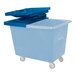 A blue plastic bin with a hinged lid on wheels.