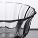 A close up of a Libbey glass bowl with a black rim.