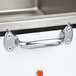A stainless steel countertop food cooker/warmer with a handle.