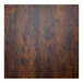 A close up of a BFM Seating vintage walnut melamine table top.
