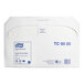 A white Tork box with blue text reading "Tork Universal Half Fold Paper Toilet Seat Cover" and "5000"