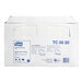 A white box with blue text reading "Tork Universal Half Fold Paper Toilet Seat Cover"