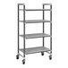 A Cambro Elements metal shelving unit with wheels and four shelves.