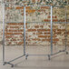 A Flash Furniture clear acrylic room divider with lockable casters.