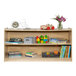 A Flash Furniture wood classroom storage cabinet with books and toys on the shelves.