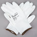 A pair of small white Cordova warehouse gloves with white polyurethane palm coating.