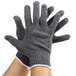 A pair of small gray Cordova economy weight work gloves with white stitching on a white background.