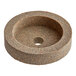 A circular sharpening stone with a hole in the center.