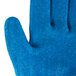 A close up of a blue Cordova glove with a crinkle latex palm.