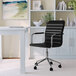 A Martha Stewart black faux leather office chair with a polished nickel base.