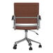 A Martha Stewart brown faux leather swivel office chair with polished nickel base and wheels.