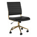 A Martha Stewart black faux leather office chair with gold accents.