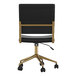 A Martha Stewart Ivy black faux leather office chair with polished brass accents.